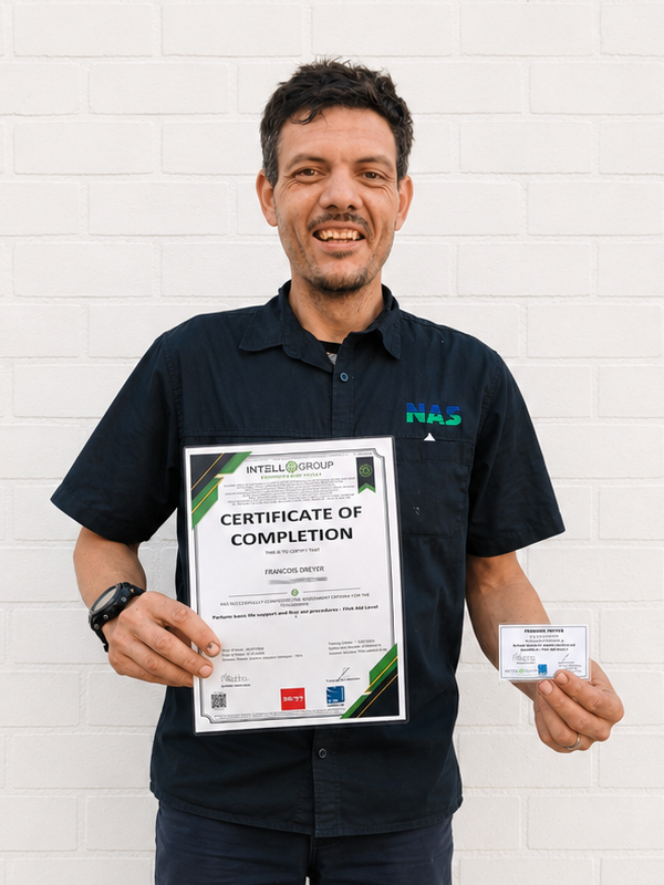 Francois holding his First Aid Level 1 certificate